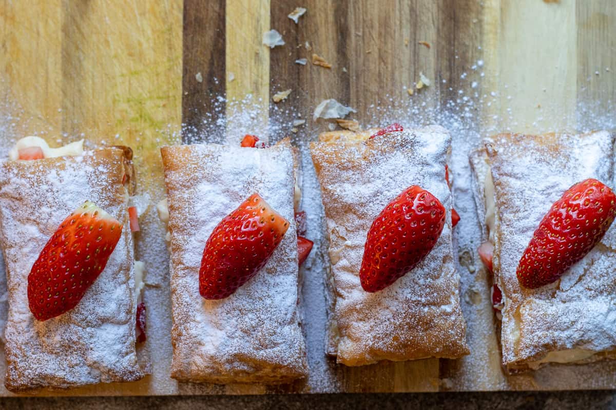 sprinkle on some icing sugar and garnish with a strawberry