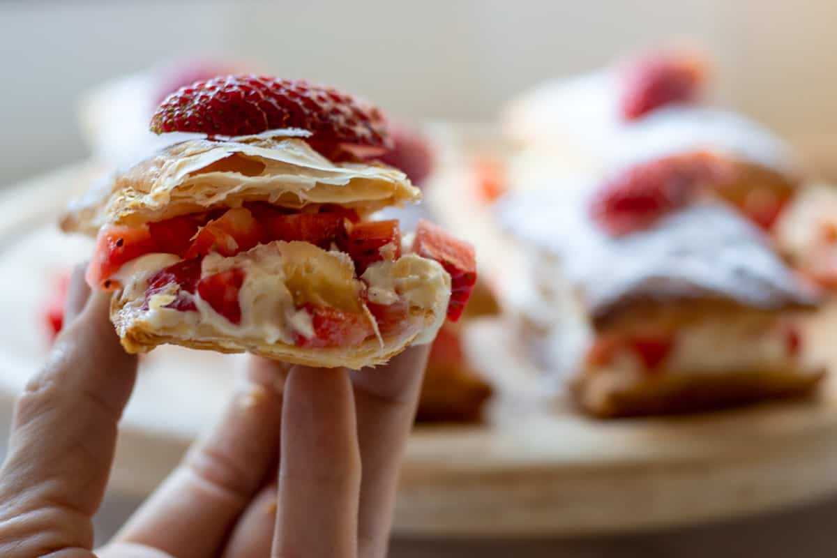 a slice of Easy Strawberry Puff Pastry Stacks with Cream