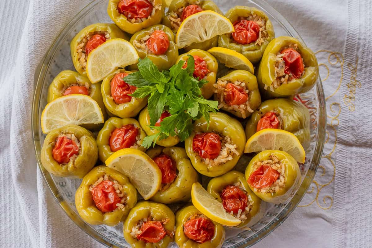 stuffed peppers with vegetarian rice filling are served on a tray