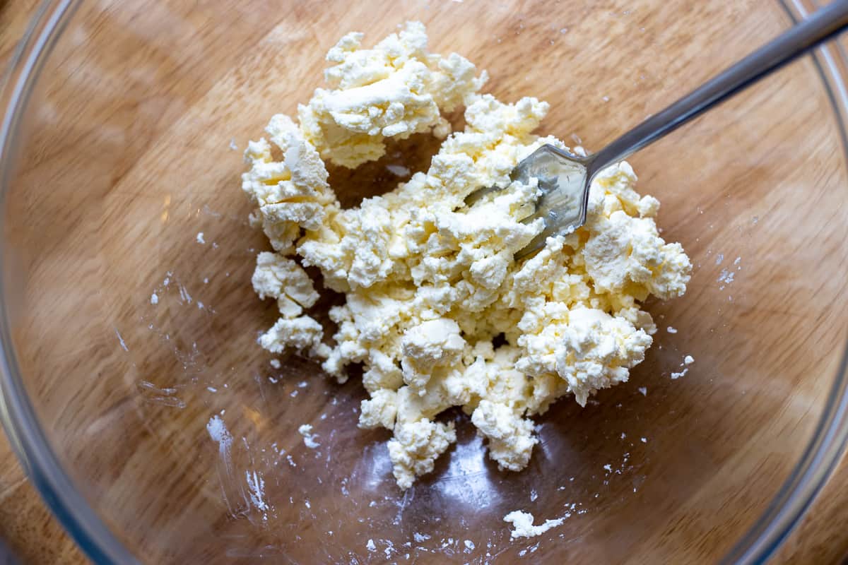 Puréing the feta with the back of a fork