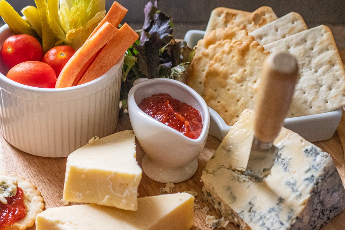 tomato chili jam is served as a part of a cheese board