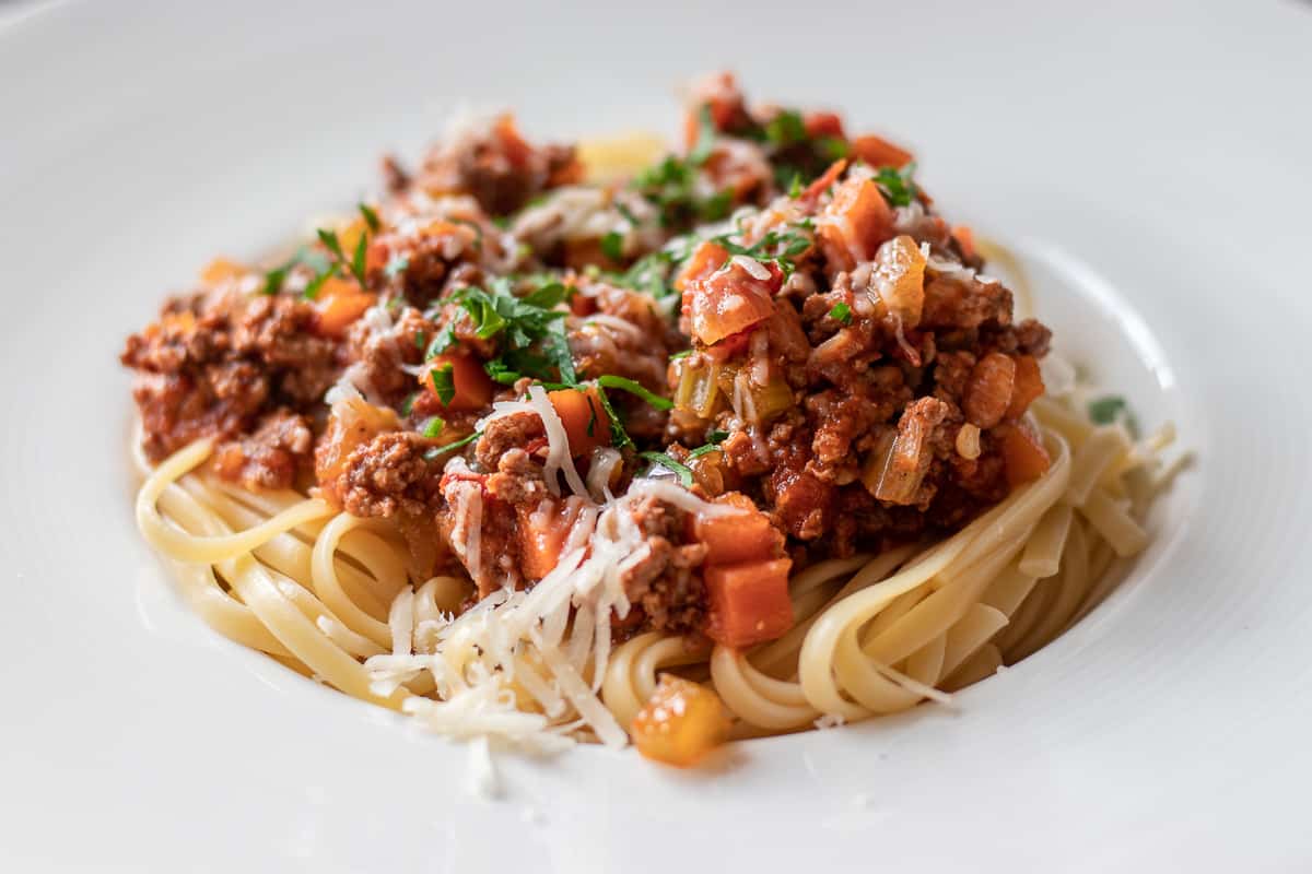 Lamb Bolognese with linguine pasta served on a plate