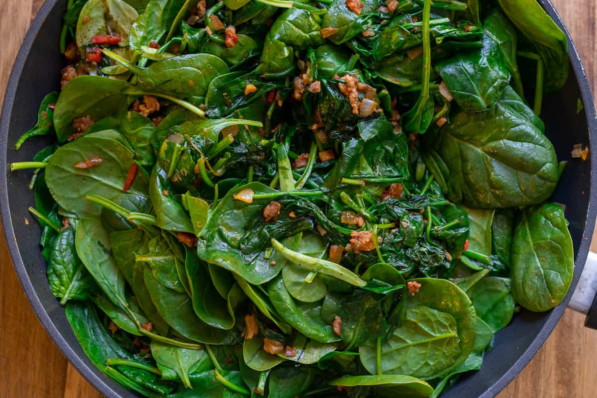 adding the spinach and sautéing for few minutes