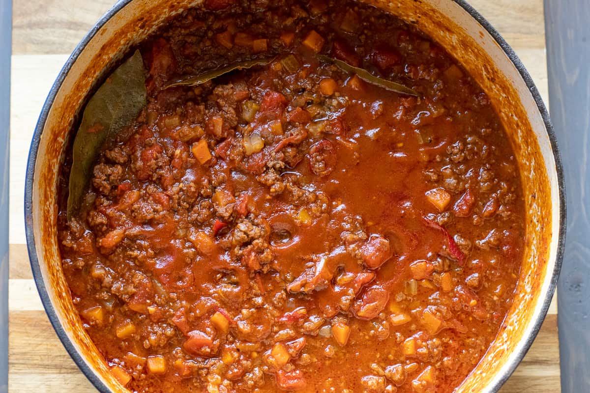The meat sauce for lasagne is cooked for 2 ½ hours.