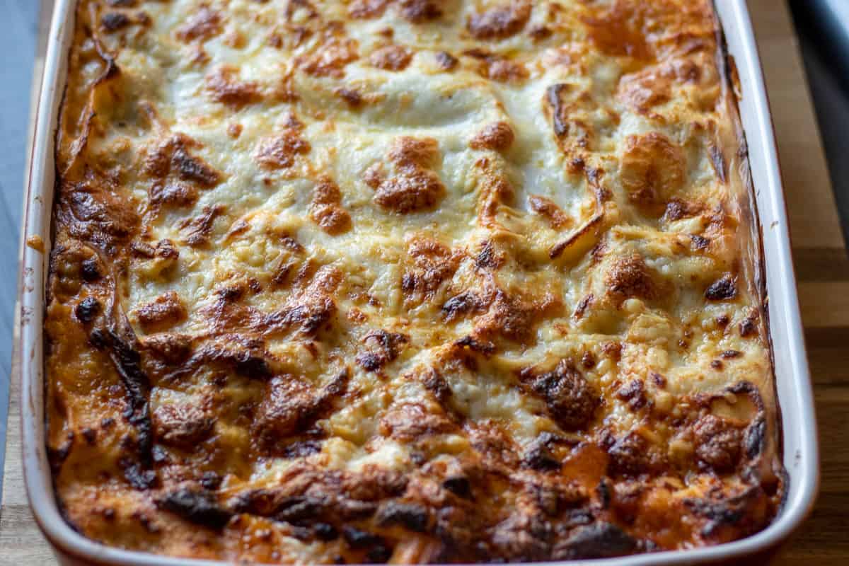 Freshly baked lasagne in a baking dish.