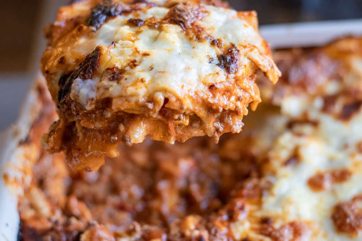 A slice of lasagne without ricotta cheese.