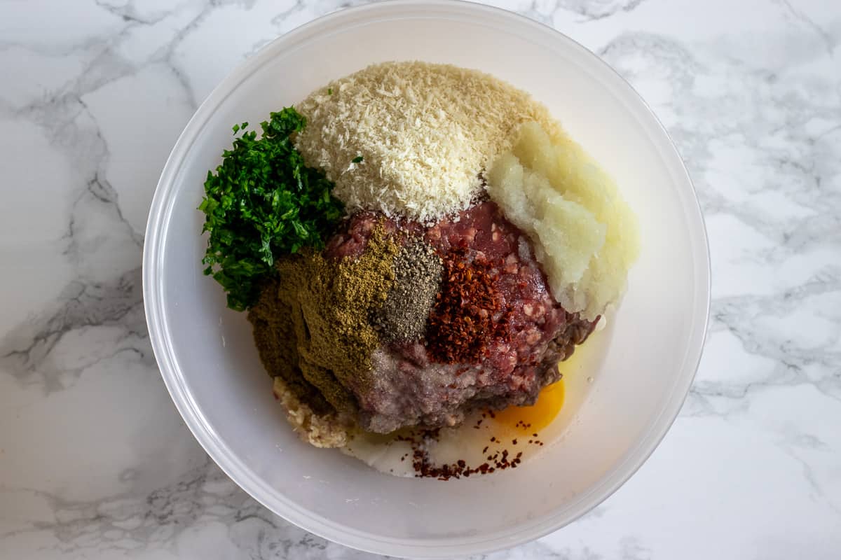 kofte ingredients are placed in a bowl for mixing