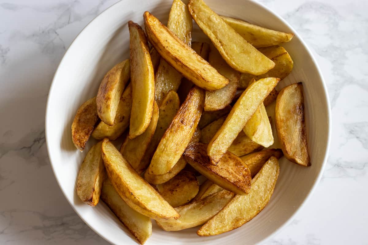 potato wedges are lightly fried in oil