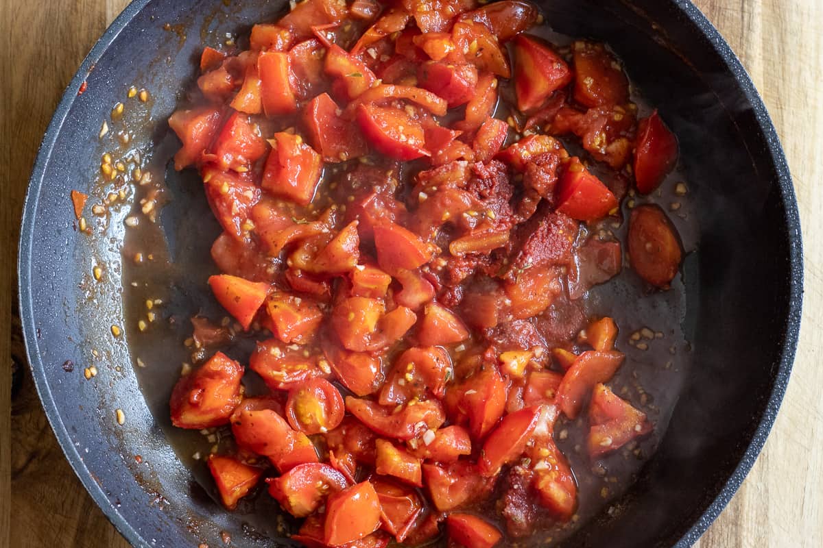tomato paste is added to tomatoes