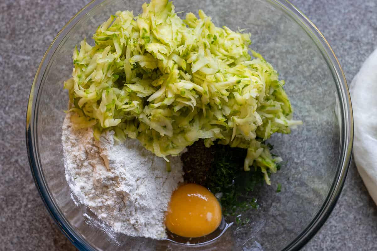 grated zucchini is added to the bowl