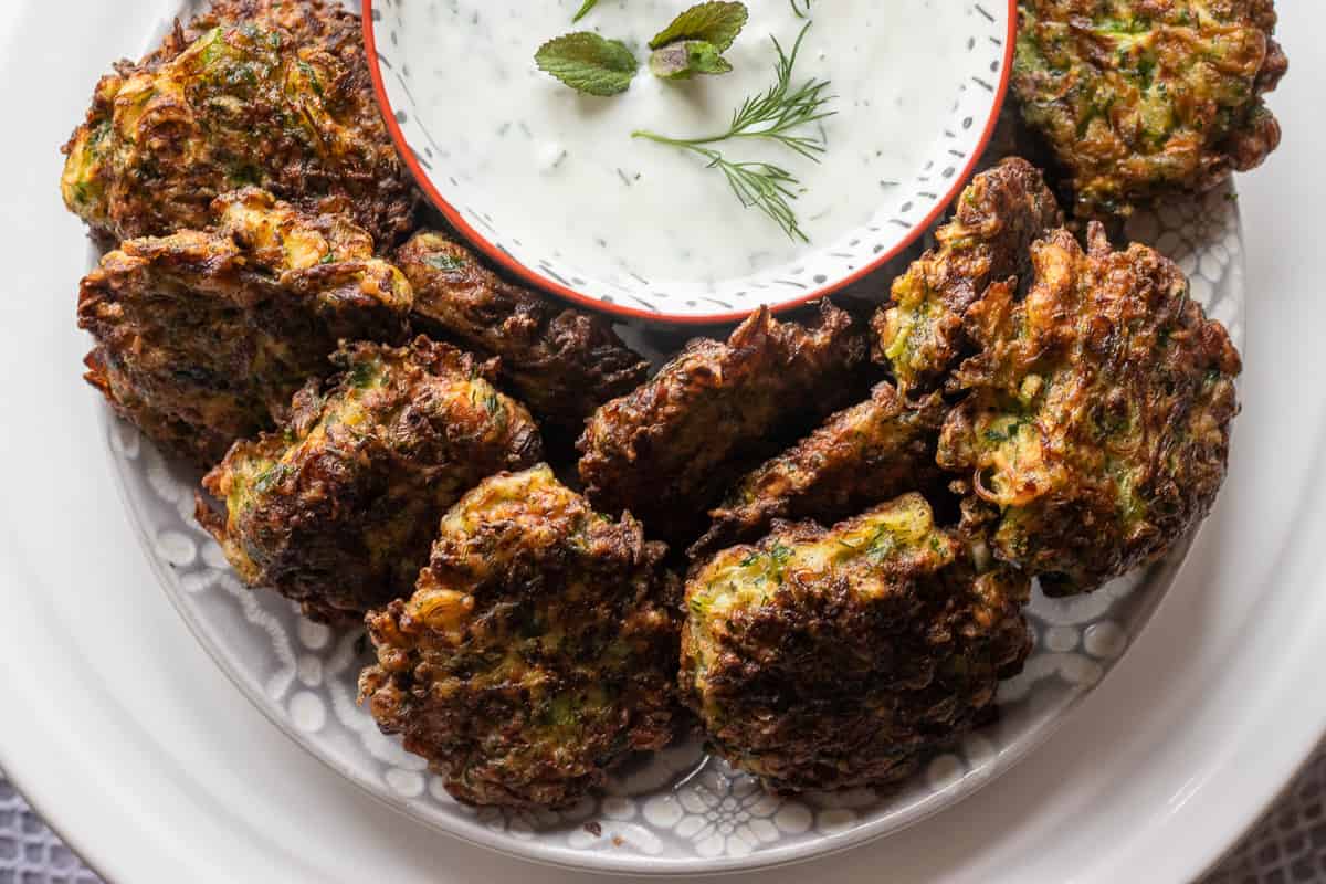 Mucver (Turkish Zucchini Fritters) is typically served with yogurt dip