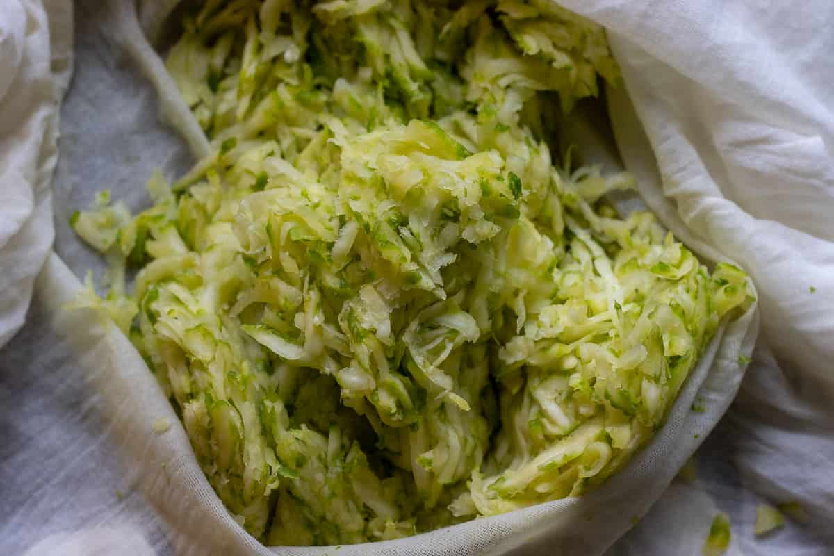 the excess water from zucchini squeezed by using a cloth