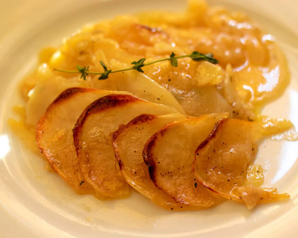 a portion of potato Boulanger is served on a plate