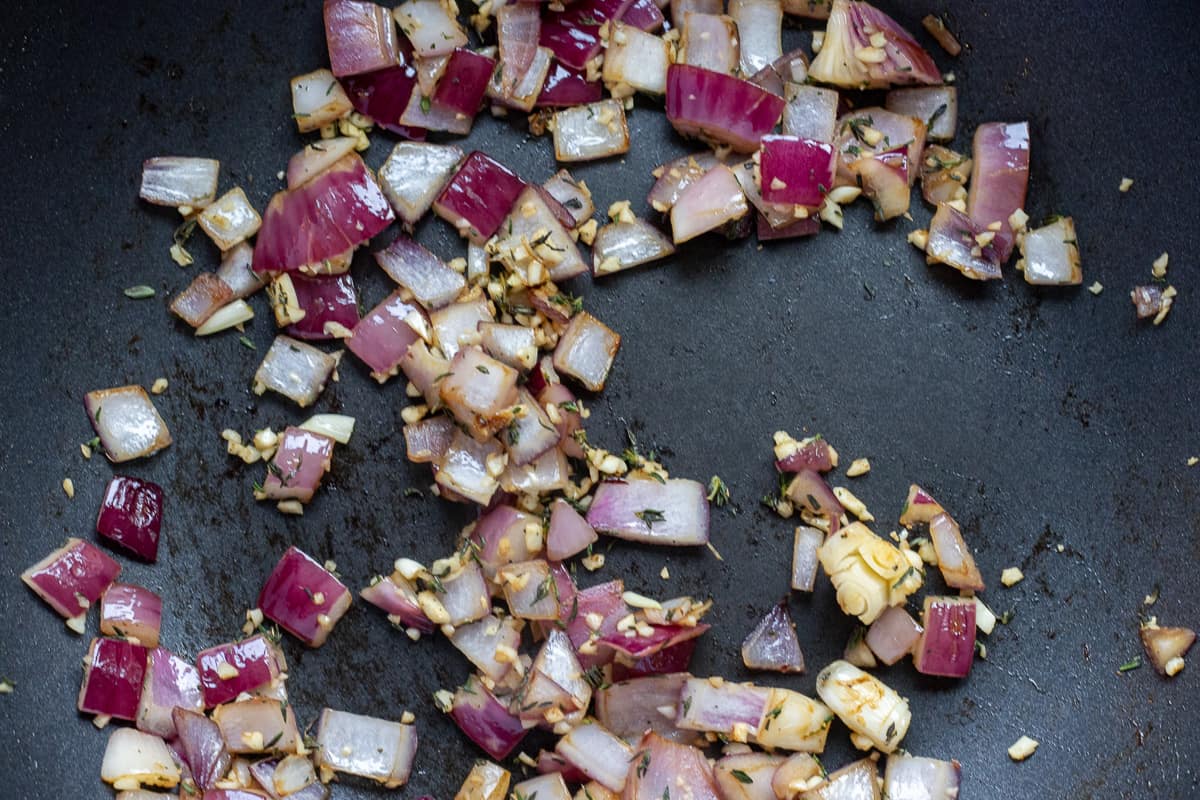Sautéing the onions, garlic and thyme with olive oil