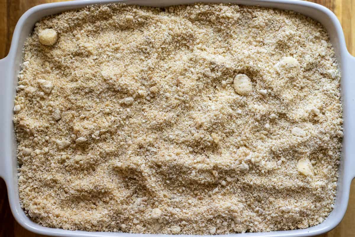 crumble is spread over the apple filling for making apple and blueberry crumble