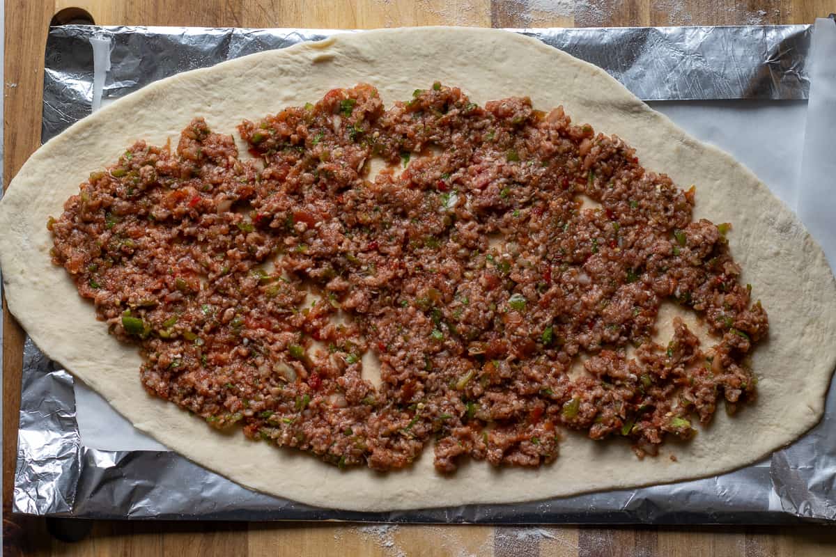 meat filling is placed in the centre of rolled out dough
