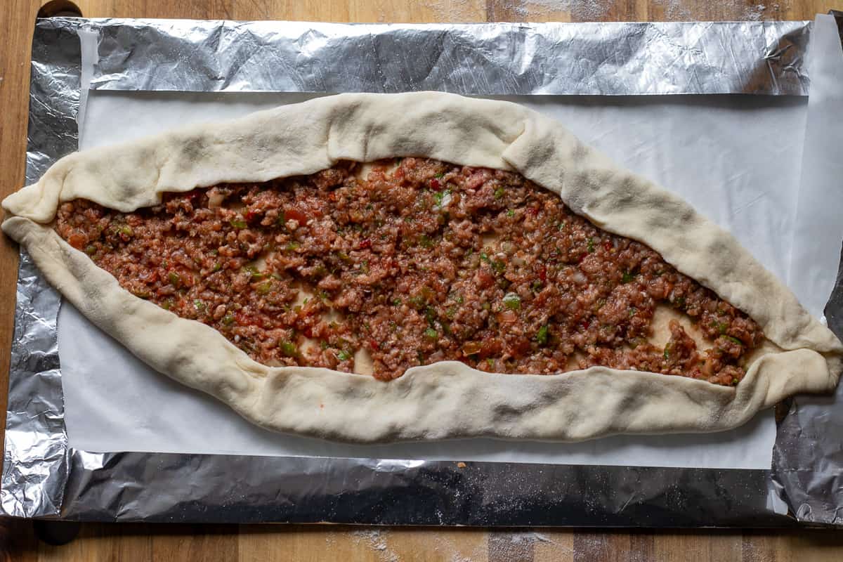 the edges of the dough are folded over the filling