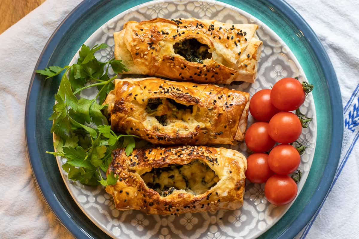 spinach and feta pie- ispanakli peynirli borek served with tomatoes and parsley