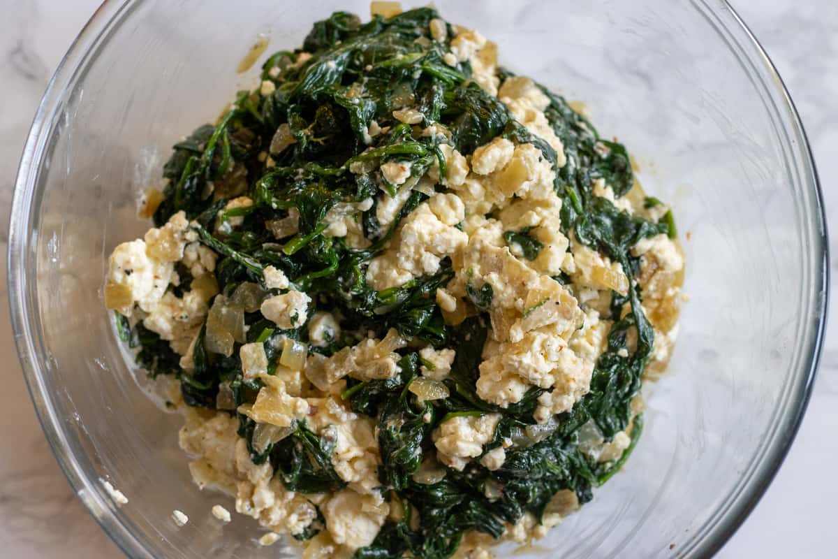 sautéed spinach is added to feta