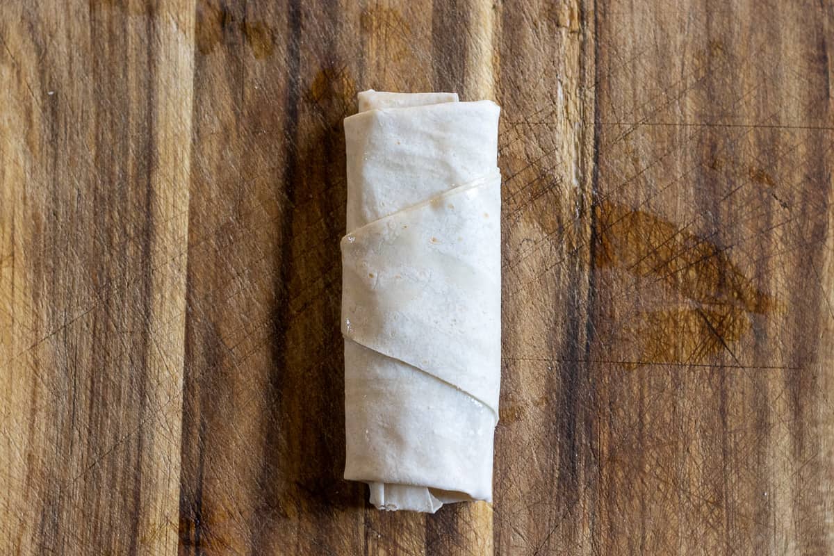 the triangle is rolled into a cigar shape