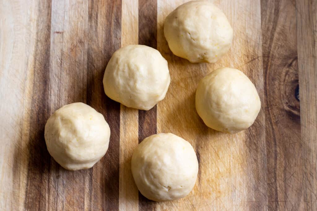 The cookie dough is divided into 5 equal-sized balls.