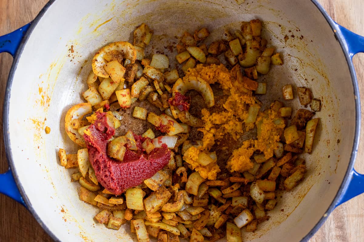 tomato paste and garlic&ginger paste are added to the pan