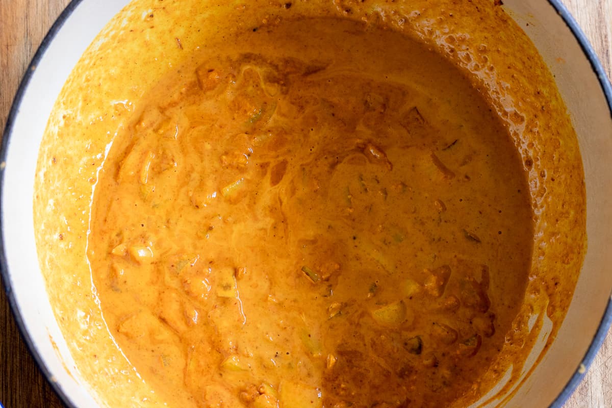 Coconut milk is added to the pan