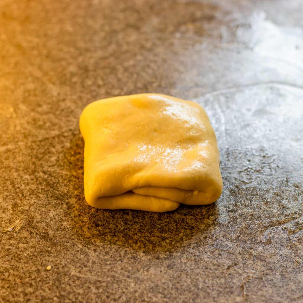 Turn the dough into a parcel by folding the sides