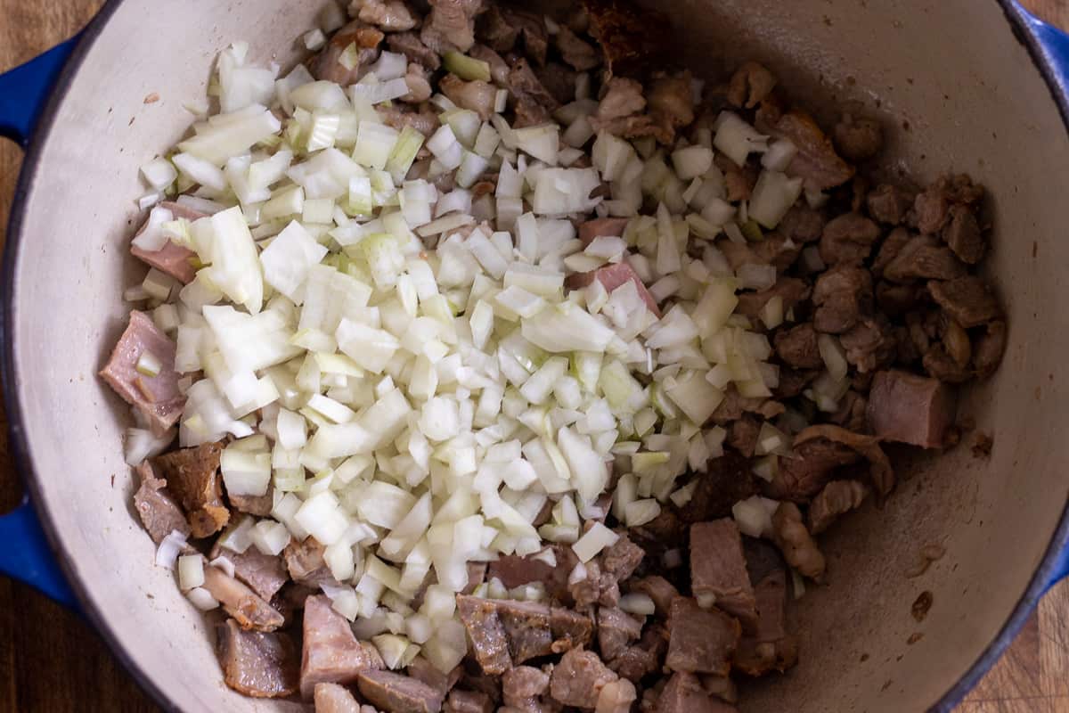 Sautéing the onions and garlic with lamb