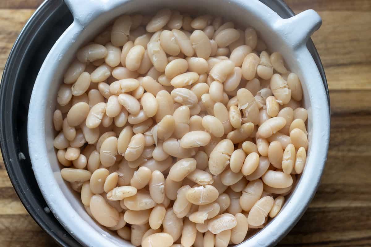 Draining the cooked beans on a colander