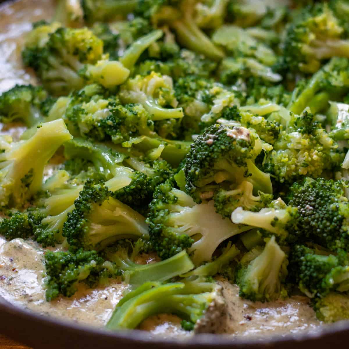 cooked broccoli fleurets are added to the creamy sauce