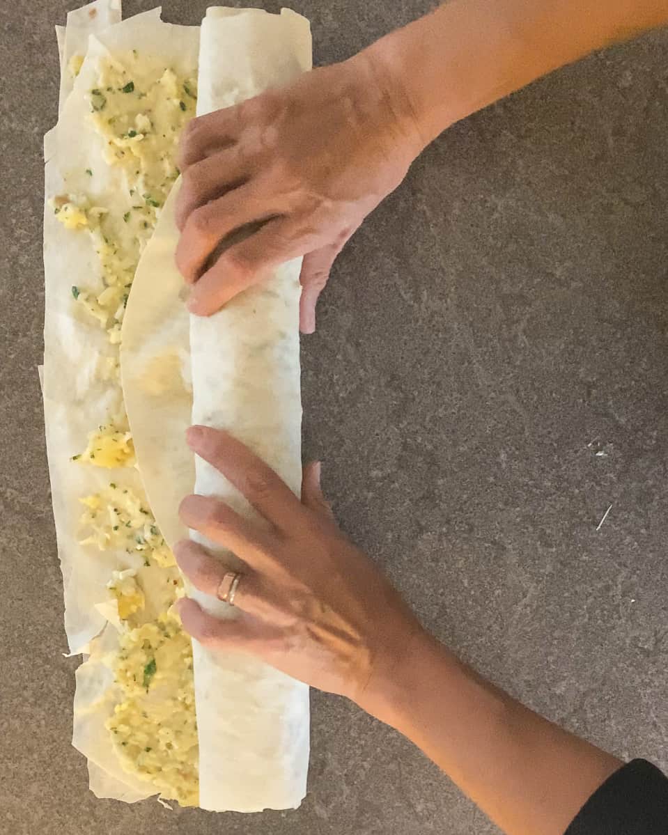 rolling to yufka to form a log shape