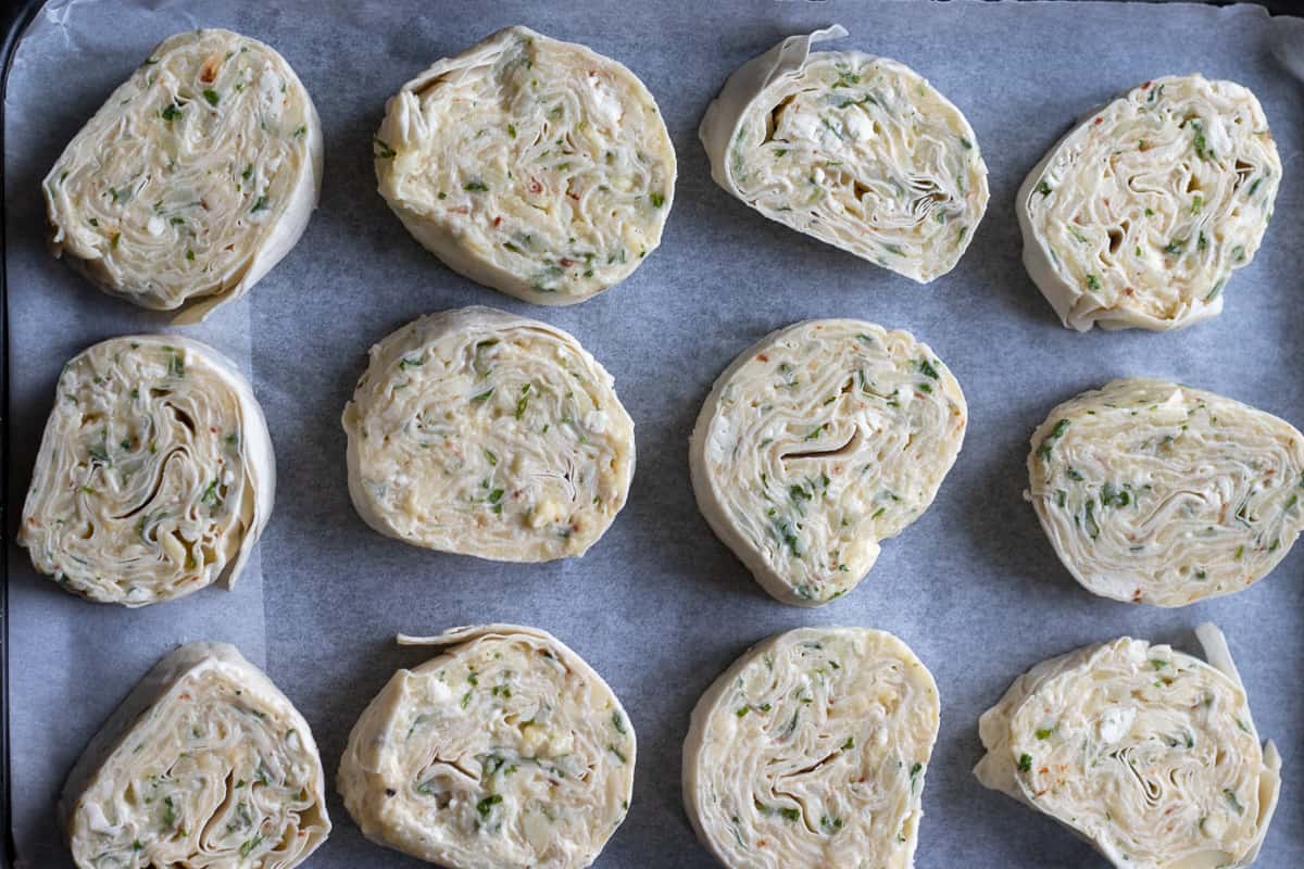 potato borek slices arranged on a baking sheet