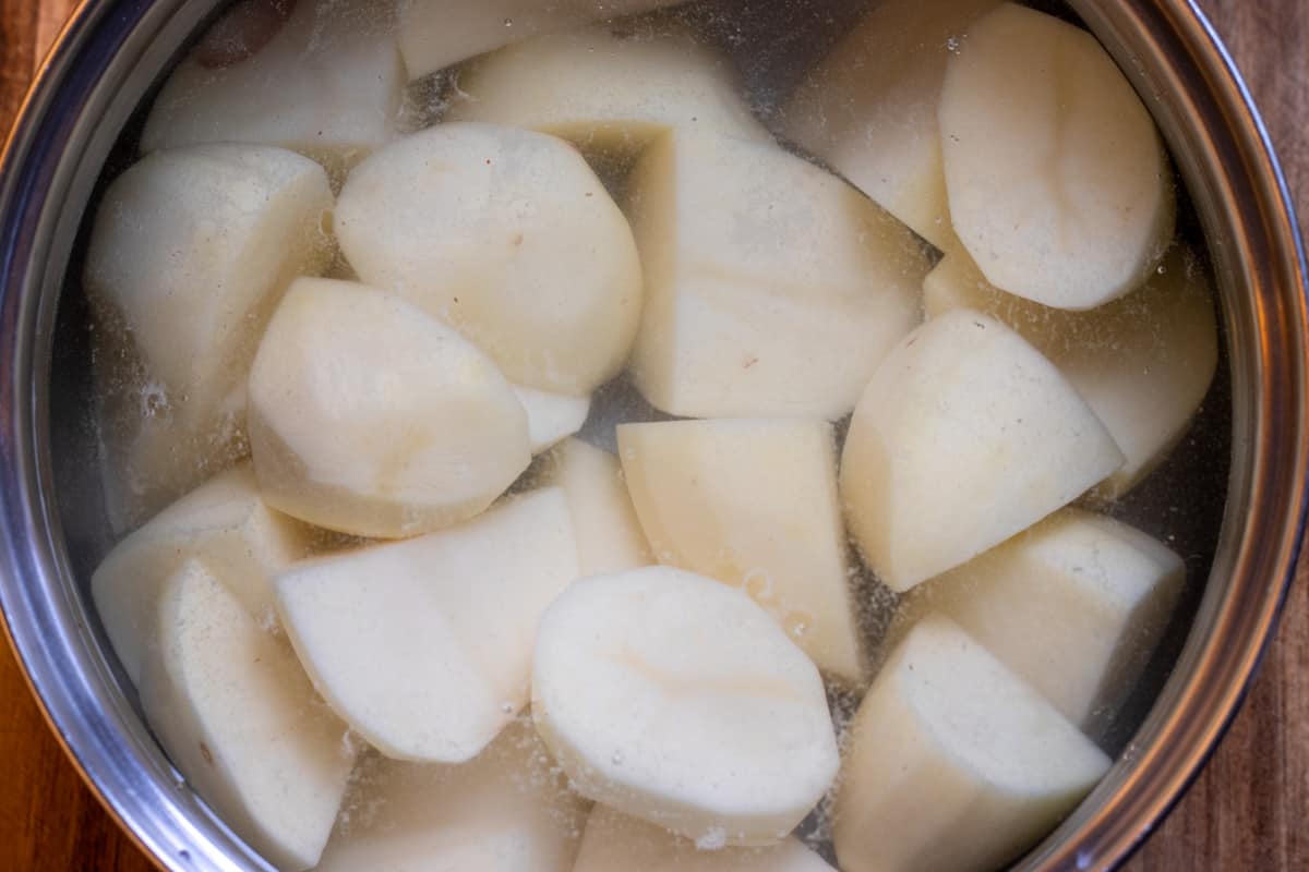 potatoes are placed in a pan with full of water
