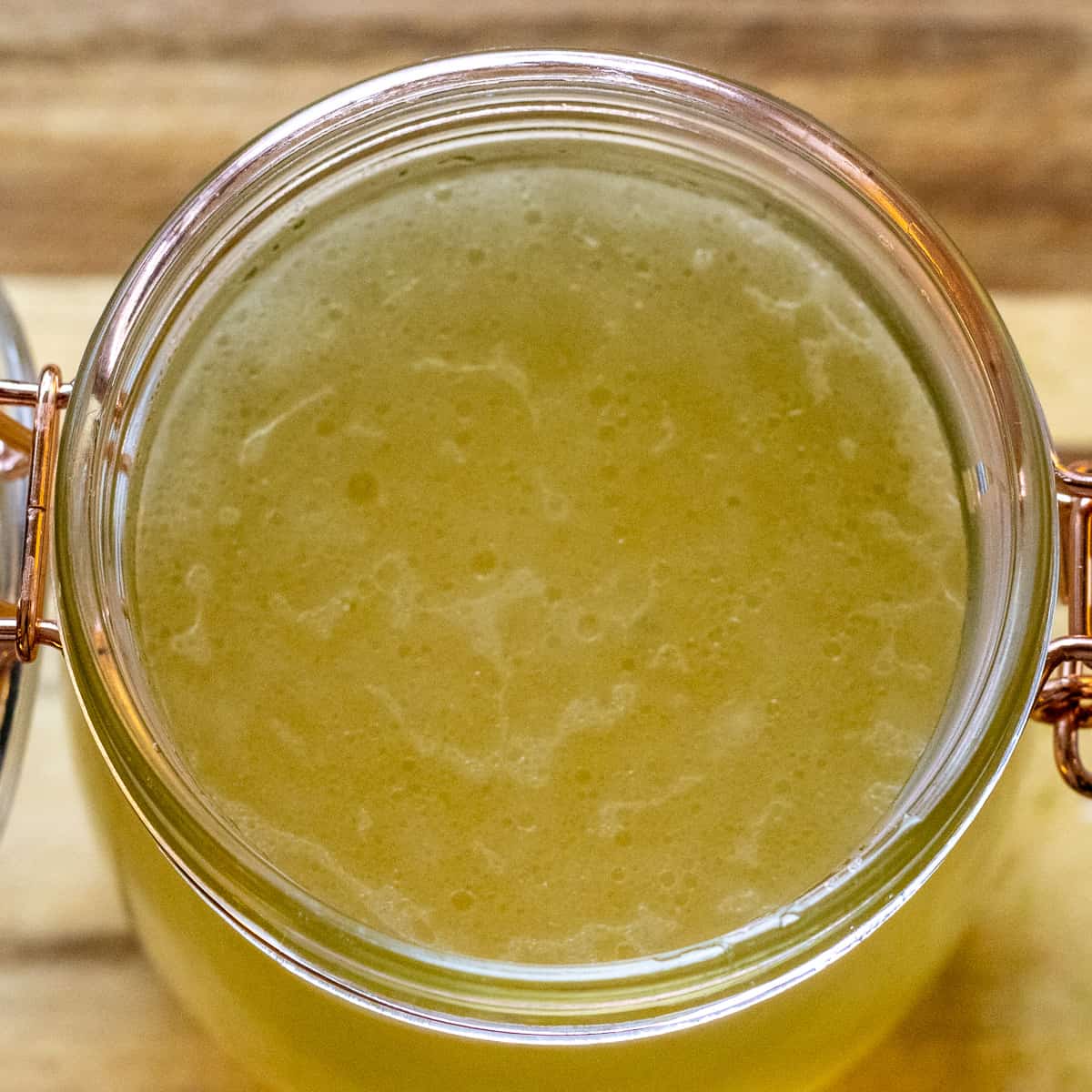 chicken stock or chicken bone broth in a glass mason jar