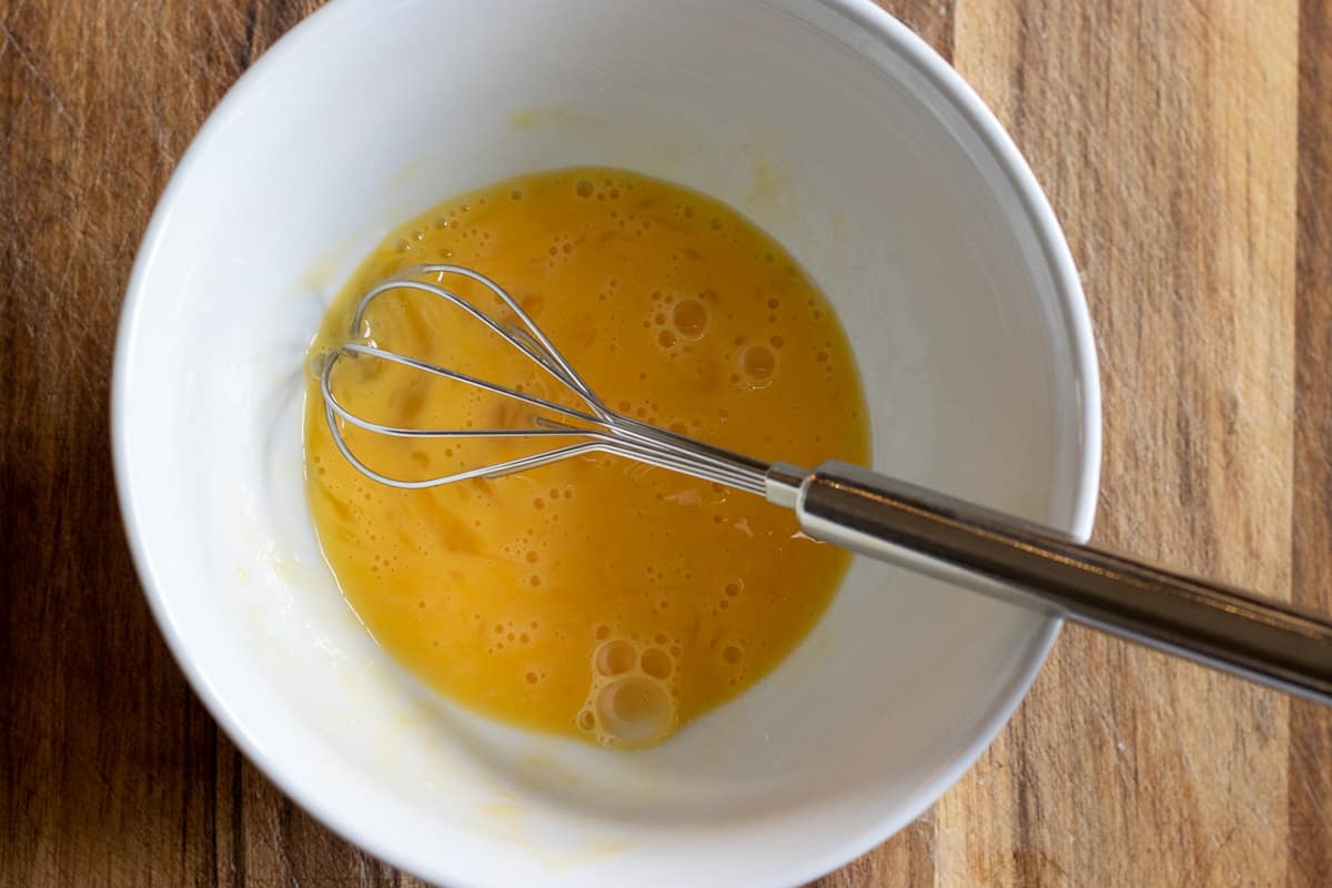 the egg is whisked in a bowl