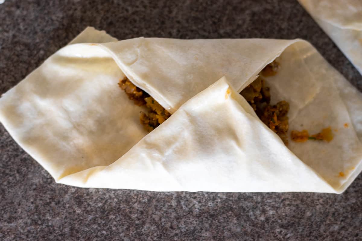 two corners are folded to meet in the middle