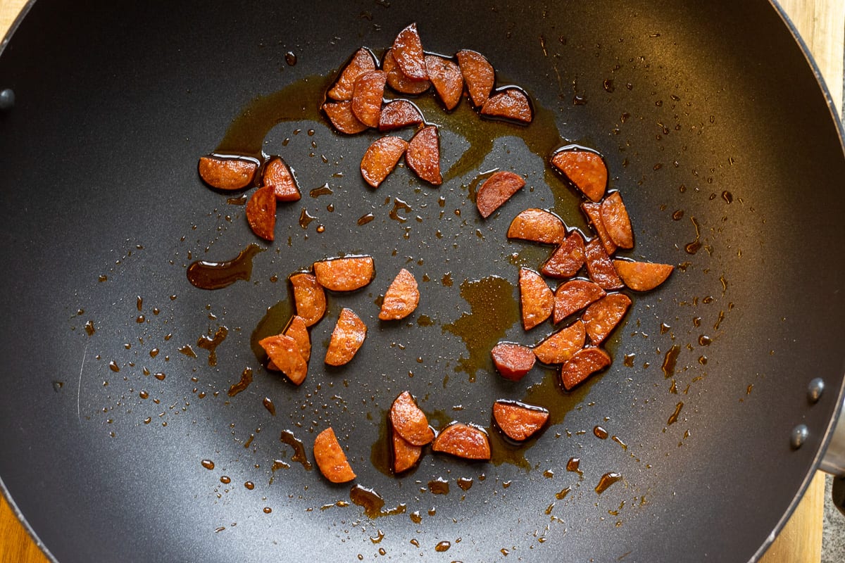 Sautéing the chorizo in a wok