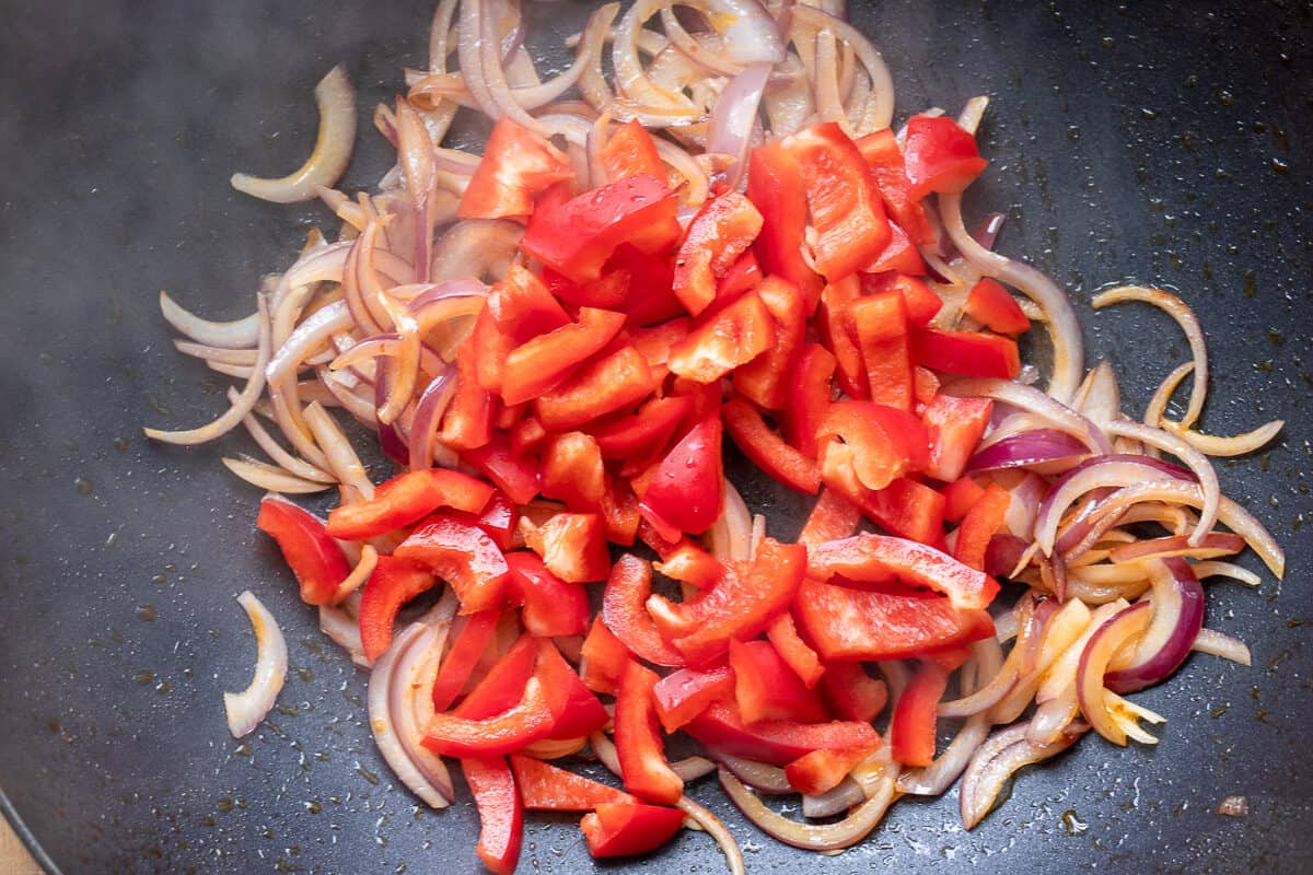 Sautéing the peppers and garlic