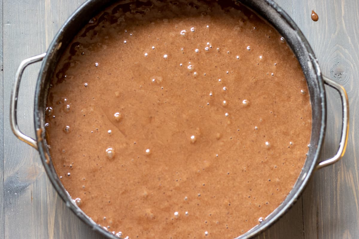 The cake batter is pored in cake tin