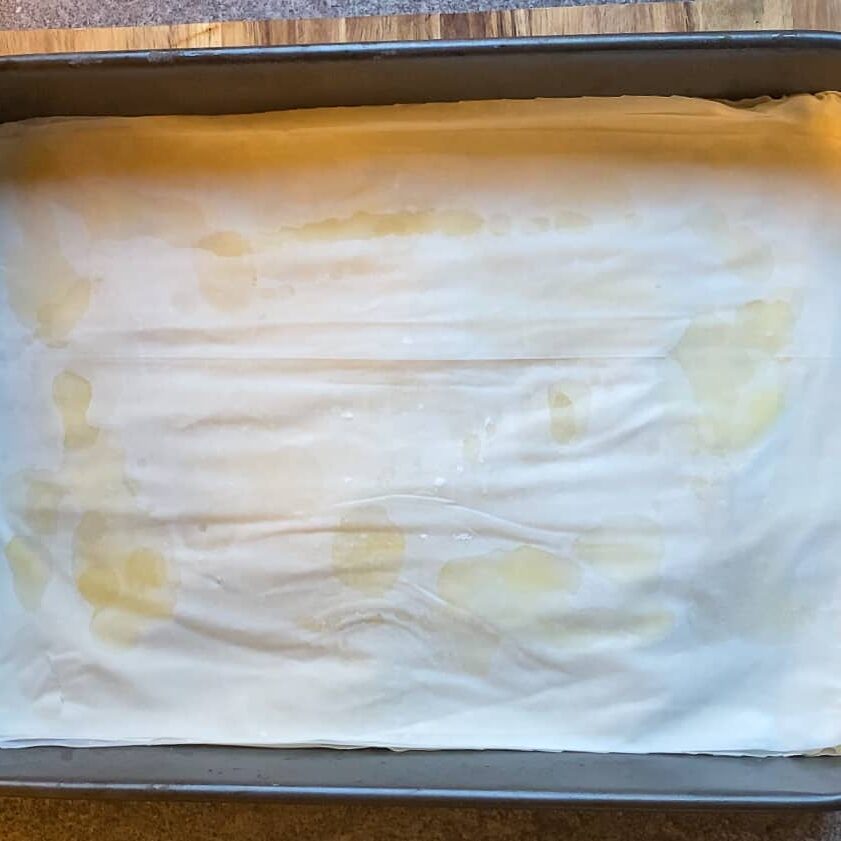 filo pastries layered over the nuts