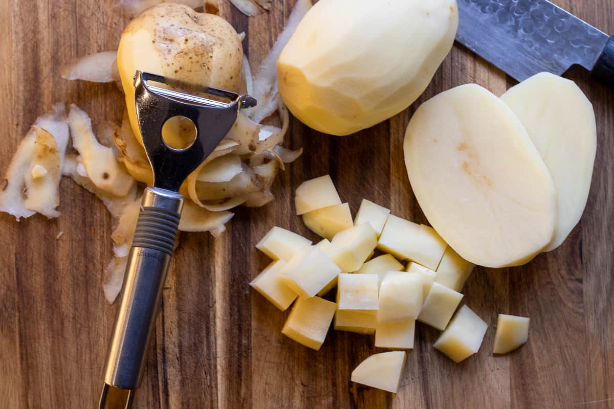 Potatoes are peeled and diced for making sauté potatoes
