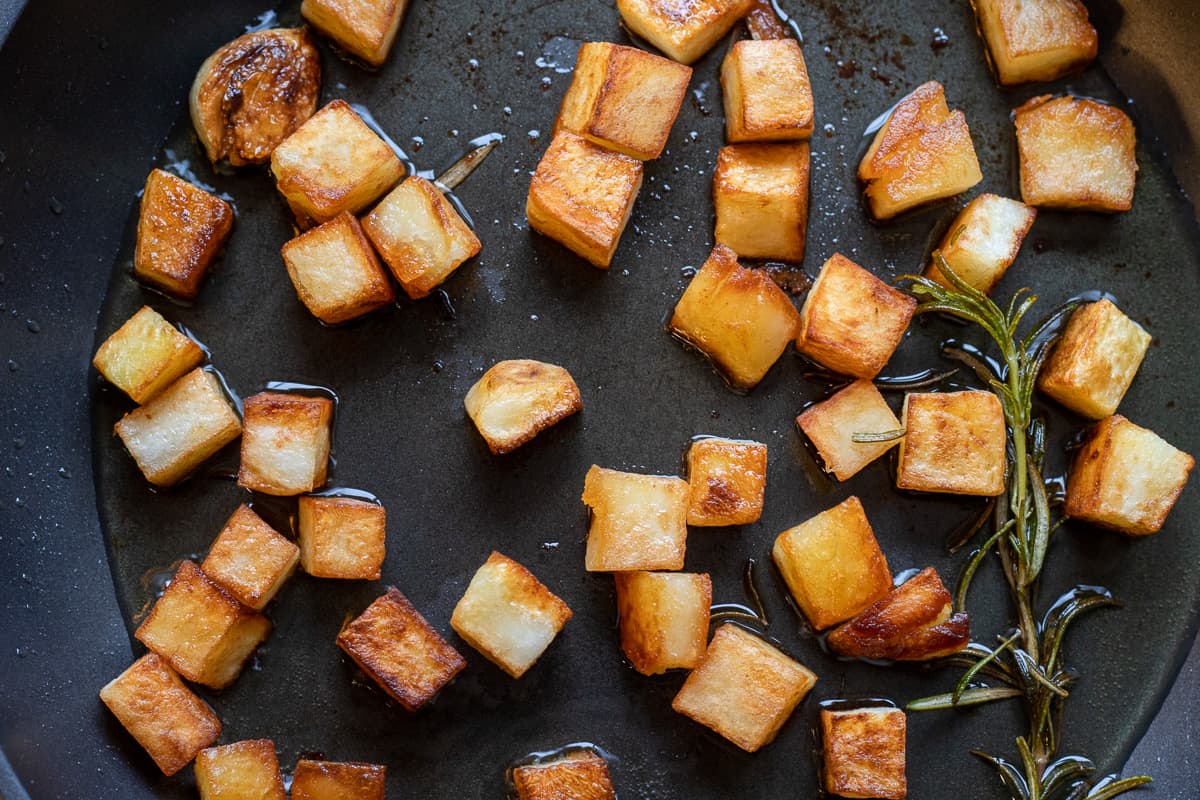 The potatoes are sautéed until golden and crispy