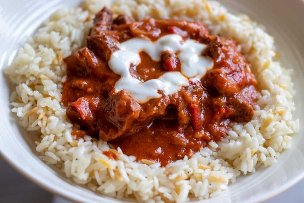 lamb goulash served on a bed of turkish pilav