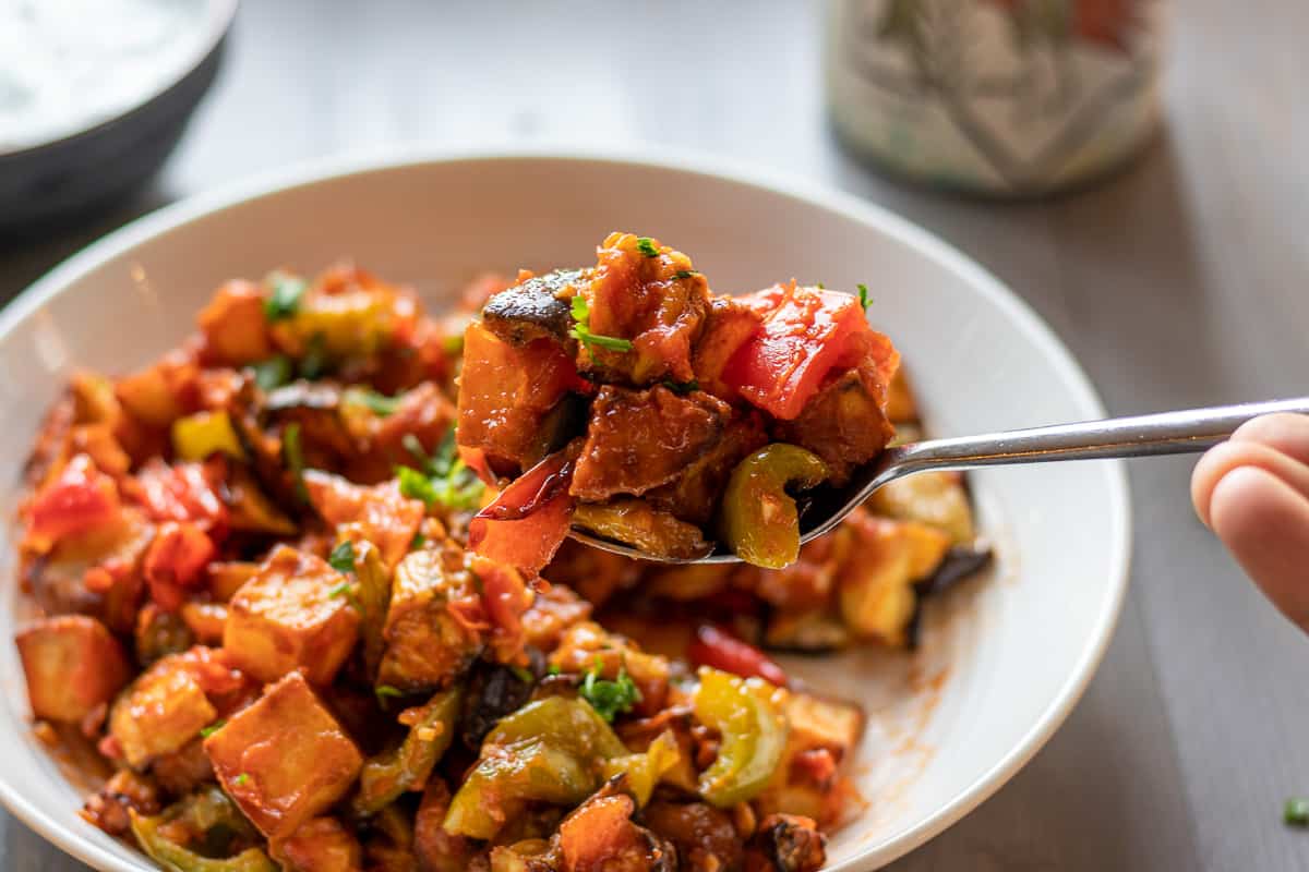 a spoonful of aubergine meze "saksuka"