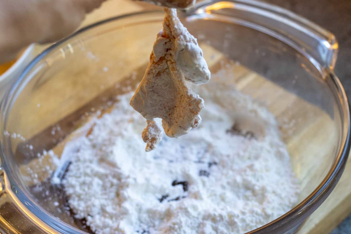 covering the chicken pieces with corn starch