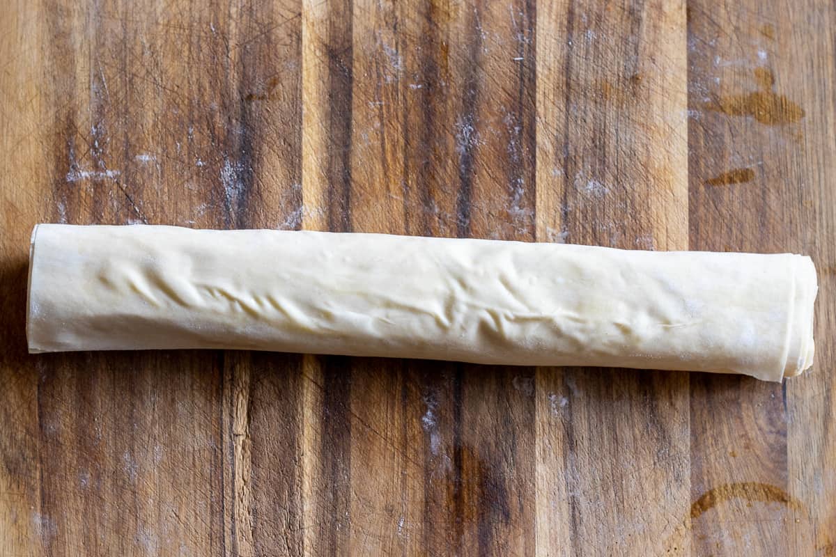 kofte is tightly rolled with yufka into a log