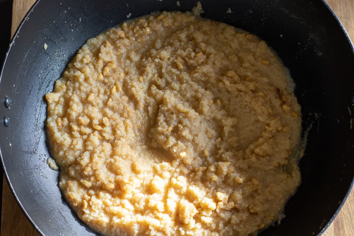 semolina has absorbed the syrup and started to thicken to form halva