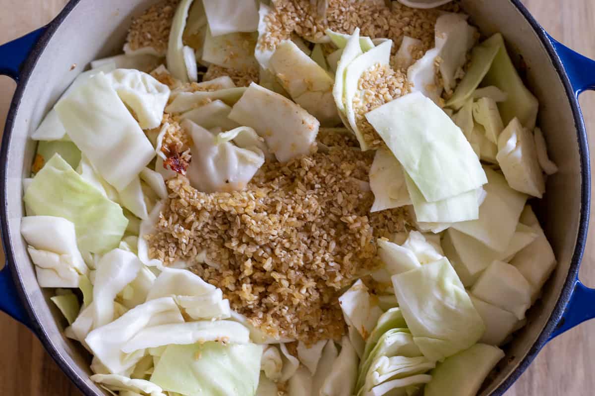 the cabbage and bulgur are added to the pan