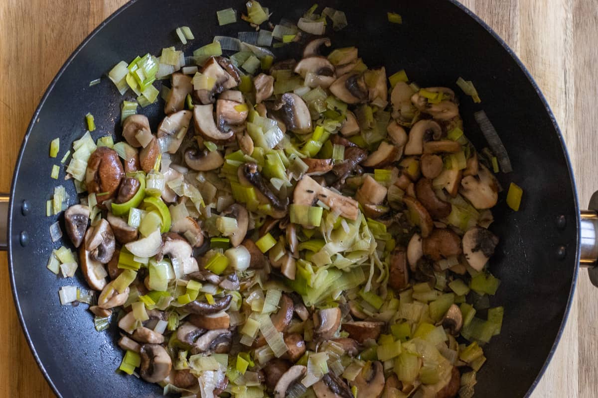 Sautéing the mushrooms with leeks